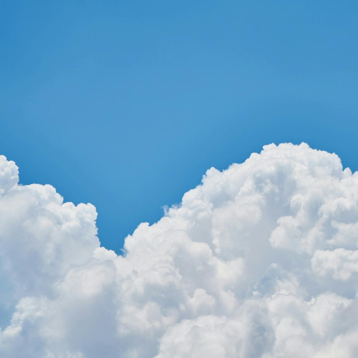 blue sky with fluffy white clouds